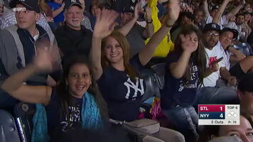 Yankee fans boob shakes as she waves to camera.