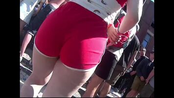 Huge ass in tight red shorts