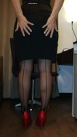 Fully fashioned stockings, red heels, black skirt pulled up