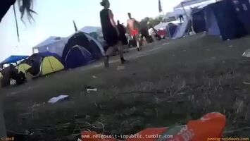 Girl at festival bends over and pees