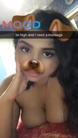 Who trying to massage her tits