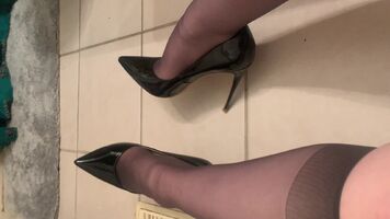 Taking off fuck-me pumps and stockings!
