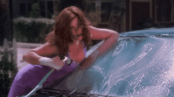 Liv Tyler washes a car