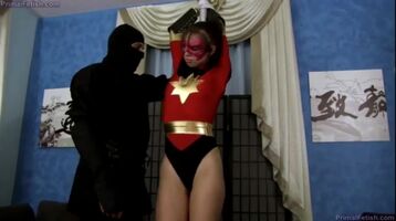 Captured superheroine forced to suck dick