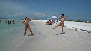 Naked cartwheels on the beach